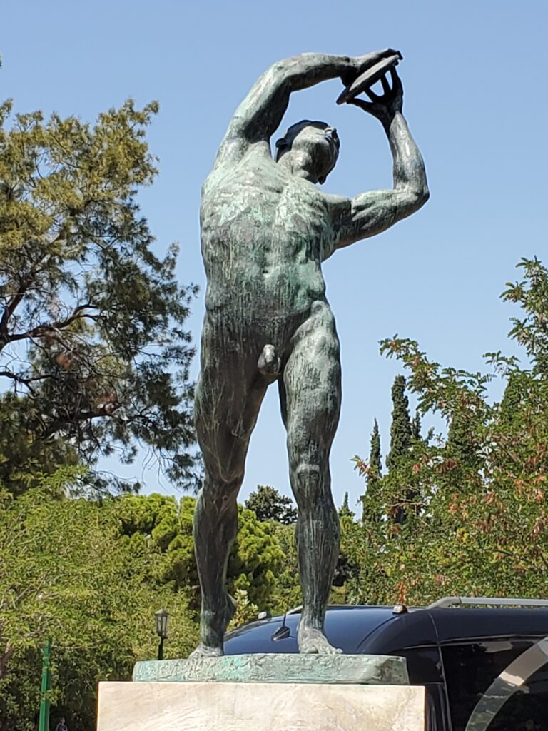 naked statue across from stadium