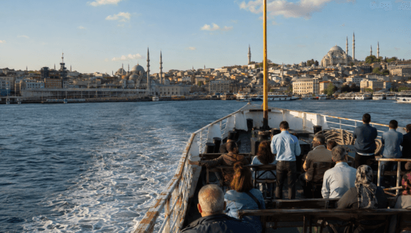 View from the bow of a public Istanbul ferry with the historic skyline filling the horizon ahead