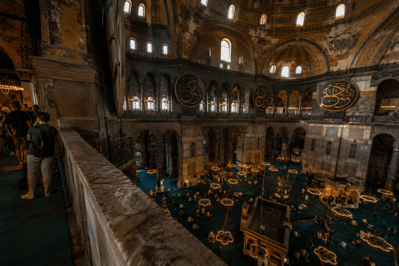 The interior of Hagia Sophia seen from the upper visitor gallery looking down into the prayer floor