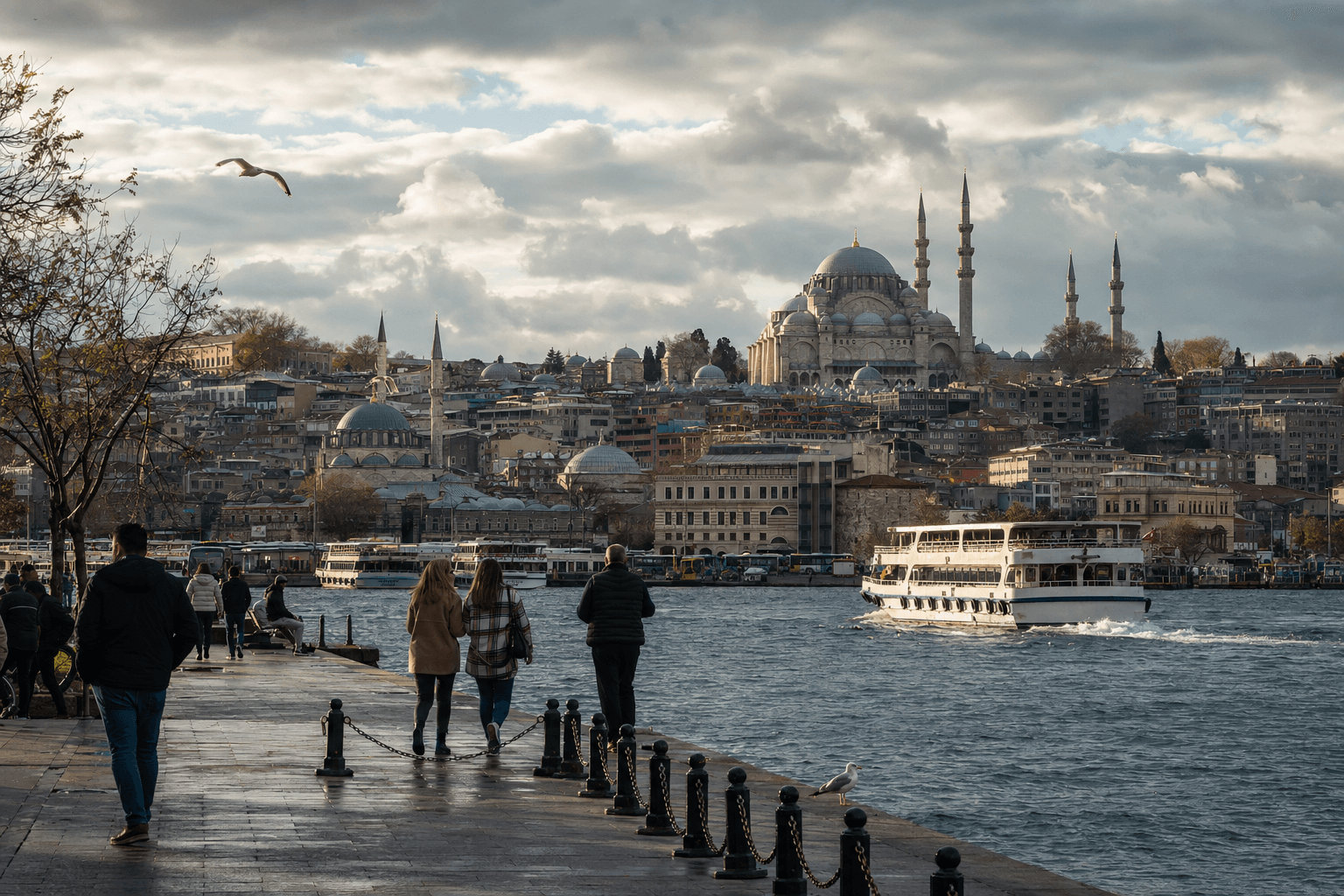 Istanbul waterfront in cool transitional weather with a ferry crossing and Suleymaniye catching the sun