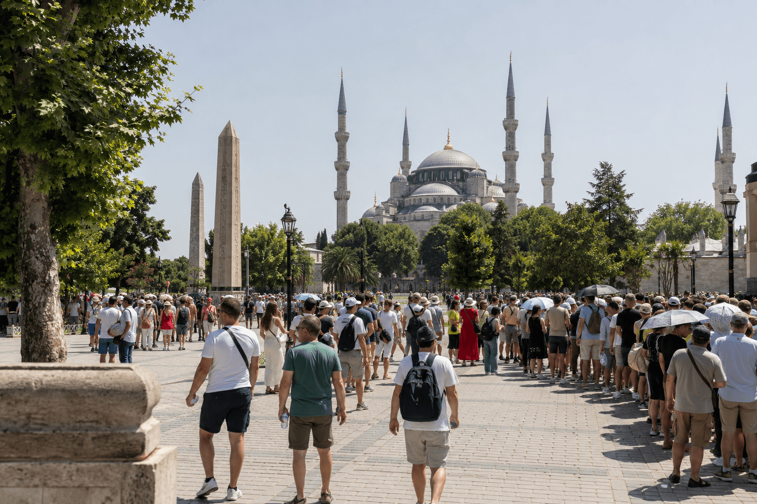 A summer queue under sun umbrellas on the same Sultanahmet approach in hard midday light