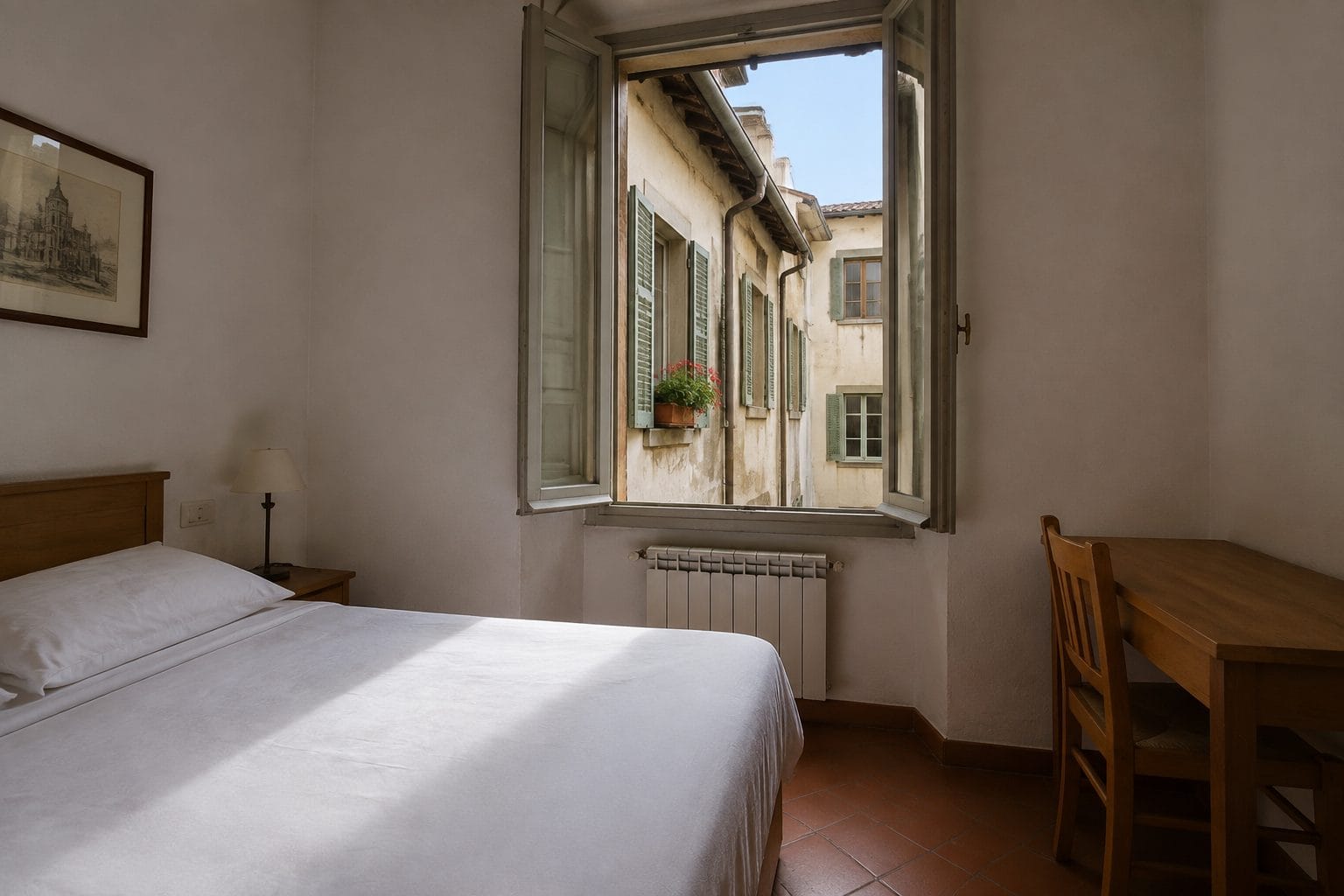 A small Florence hotel room with white bedding and an open shuttered window looking onto a narrow internal courtyard with geraniums