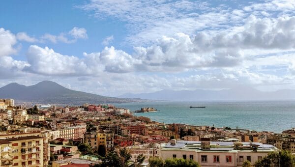 The Bay of Naples with Castel dell Ovo on the waterfront, Vesuvius beyond and ships moored at the port