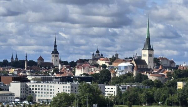 Tallinn's Old Town skyline with St Olaf's spire and the Alexander Nevsky Cathedral domes, seen from the Old City Harbour
